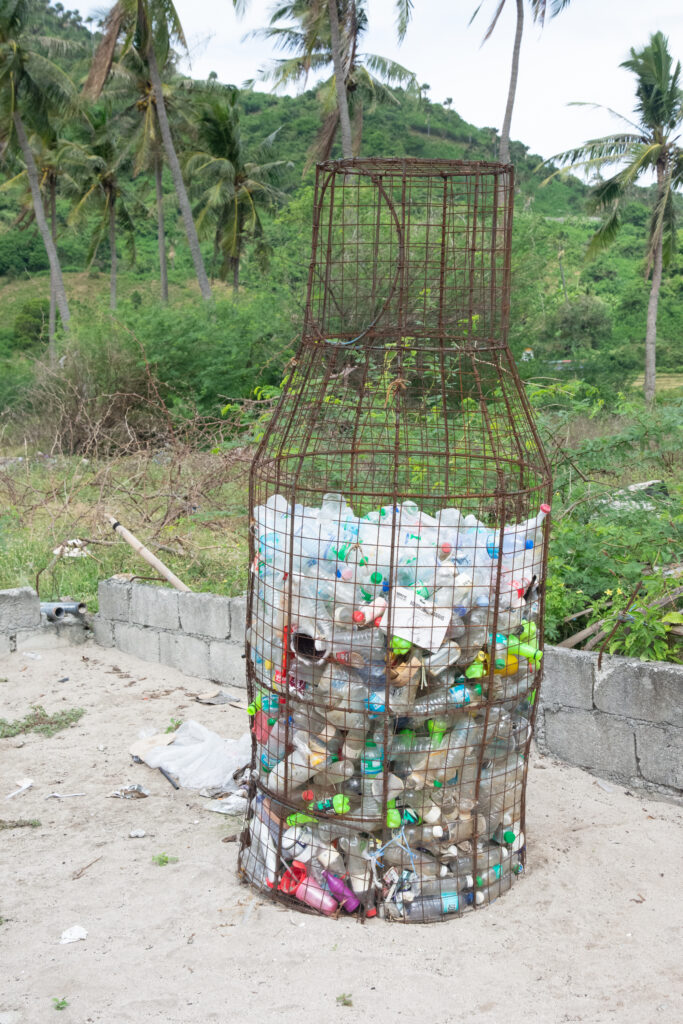 wire basket filled with plastic waste