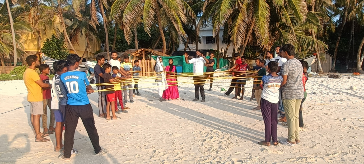 Group uses rope on the beach to illustrate the concept of a food web