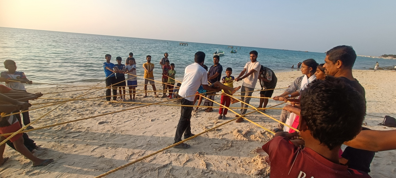 Group uses rope on the beach to illustrate the concept of a food web