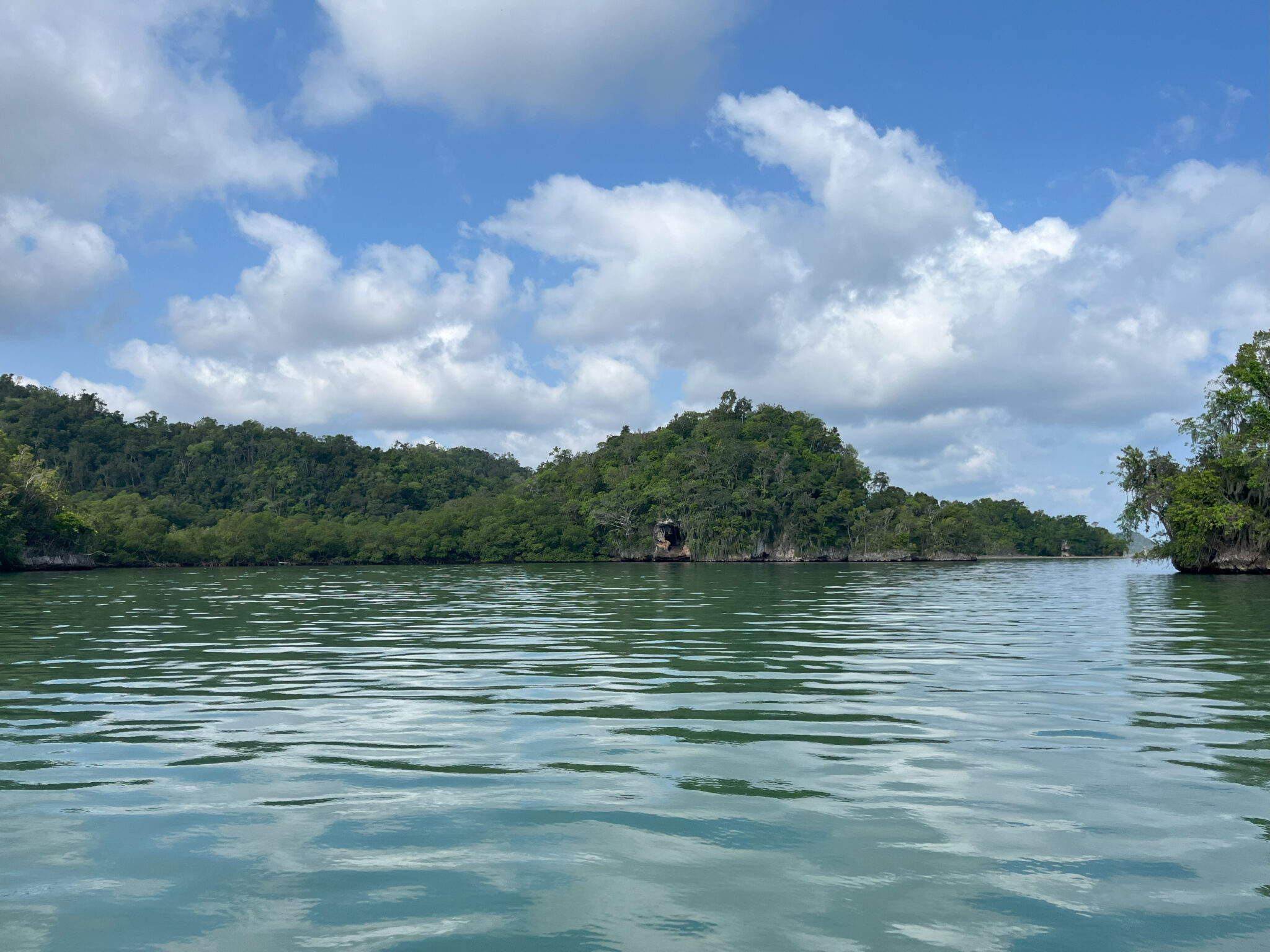 Calm bay water with hills in background