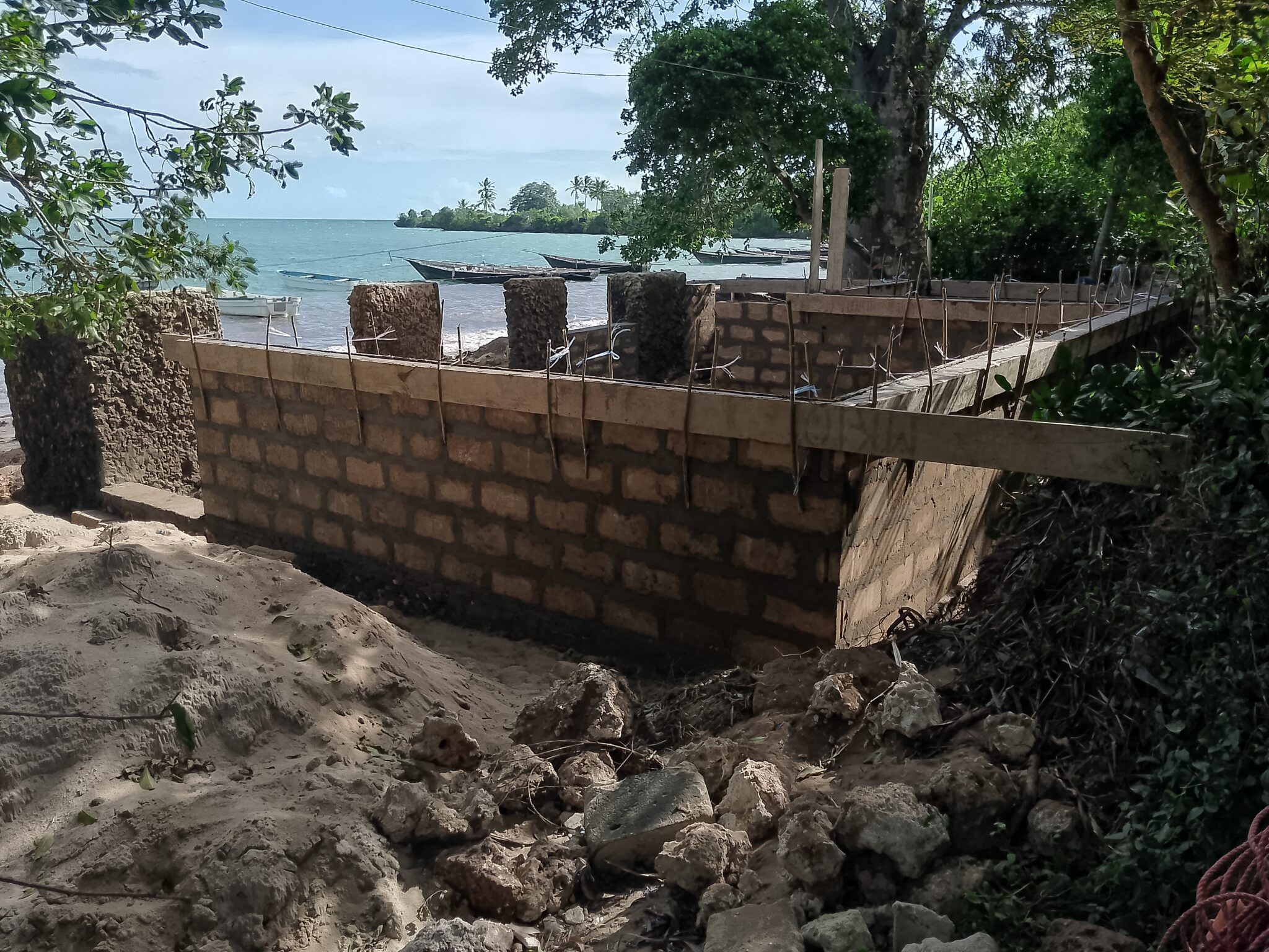 A partially constructed building overlooking the ocean