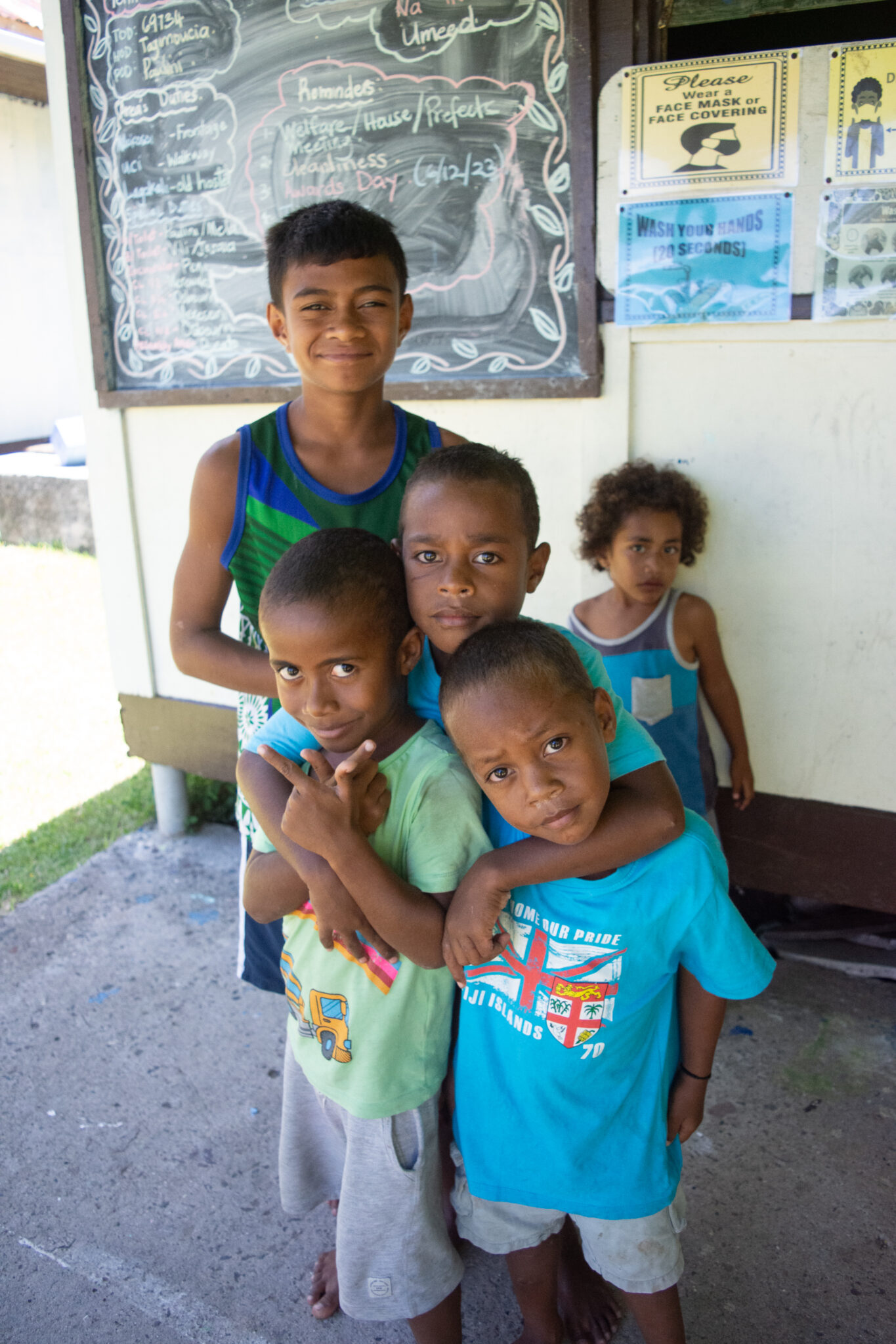 A group of kids poses for the camera